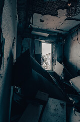 inside a destroyed house without people in an abandoned city in Ukraine
