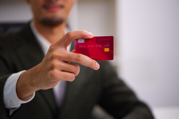 business man holding a card