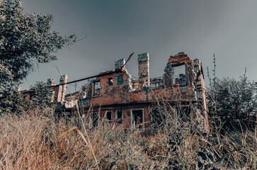 Fototapeta premium destroyed and burned houses in the city Russia Ukraine war