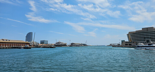 Wide angle view of a Mediterranean harbour in Spain, Europe, with docks, dry docks and open water...
