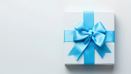 Gift box with blue bow on white background. International Women's Day celebration