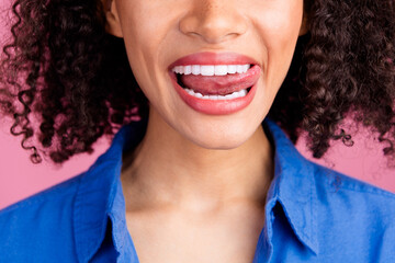 Cropped photo of charming adorable gorgeous woman licking white bright healthy teeth isolated on...