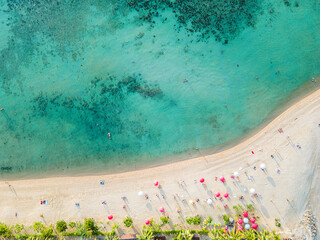 Aerial top down view of a beach with turquoise clear water in Koh Phangan Thailand