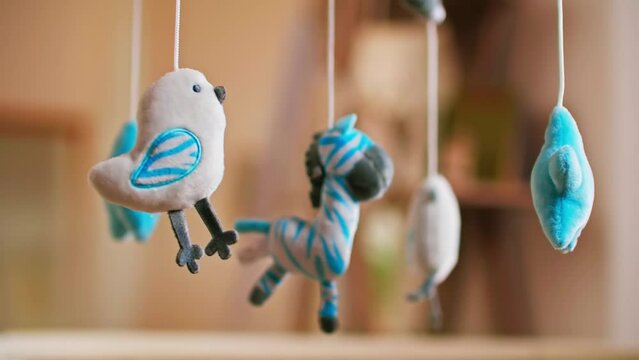 Baby toys for baby hanging above the bed. Rotate slowly.