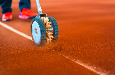 line brushing to make the line more visible in clay tennis court