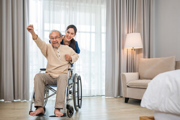 Asian senior retired old man sitting on wheelchair having fun with young woman nurse, Happy curator person doctor pushing and running elderly patient freedom raising arm, sanatorium - obrazy, fototapety, plakaty