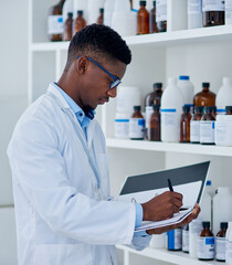 Black man, scientist and folder for inventory in lab for medical stock, update and products checklist. Doctor writing, pharmacist or bottles with chemical supply for research on paper or report