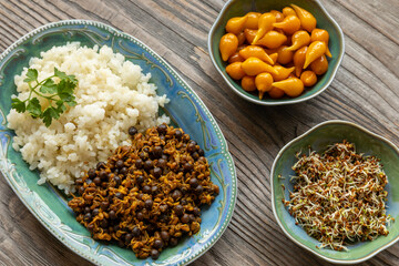 A dish made of sprouted fenugreek seeds and dried Nepali small peas (sano kerau) with rice, on the...