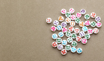 Decorative plastic beads with funny faces. White decorative stones for the necklace.