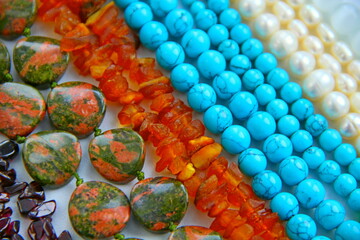 Many different natural stone minerals, gems beads necklace of red amber turquoise pearl green-blue...