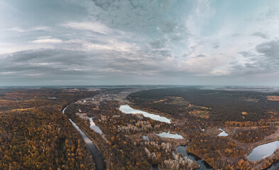 Aerial panorama of Siverskyi Donets river valley in moody autumn colors with forest on riverbanks