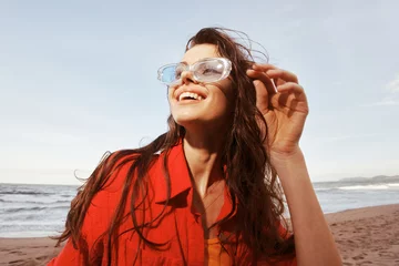 Poster Smiling Woman at the Beach, Embracing Freedom and Nature © SHOTPRIME STUDIO
