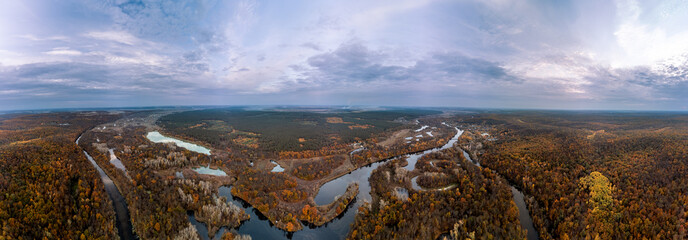 Autumn aerial panorama of Siverskyi Donets river scenery with wooded golden riverside in Ukraine