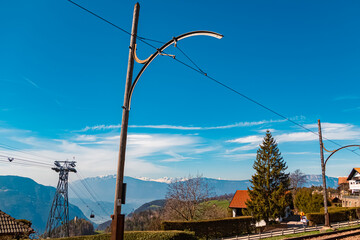 Alpine spring view with railroad tracks near Oberbozen, Ritten, Eisacktal valley, South Tyrol, Italy
