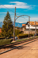 Alpine spring view with railroad tracks near Oberbozen, Ritten, Eisacktal valley, South Tyrol, Italy