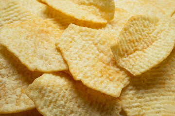 Potato fluted chips. Food background.