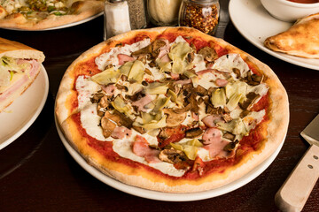 Pizza with artichokes and ham