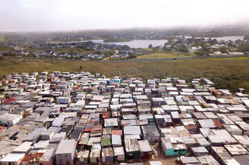 Aerial of township and wealthy houses in divided South Africa