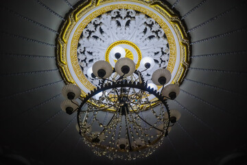 Antique chandelier on the ceiling