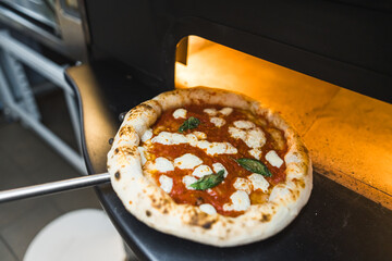 real Neapolitan Italian pizza called margherita pizza just out of the oven. High quality photo