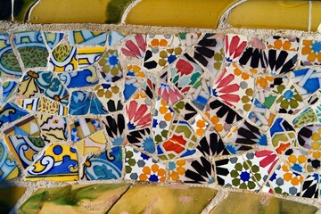 Detail of a colorful mosaic on a bench in Güell Park, Barcelona, Spain, Europe. - obrazy, fototapety, plakaty
