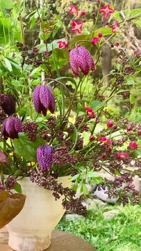 floral arrangement of garden flowers, flowers in a basket