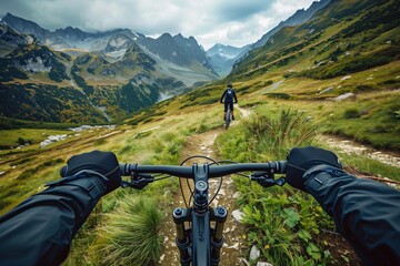 A first-person perspective captures the thrilling experience of mountain biking along a narrow...
