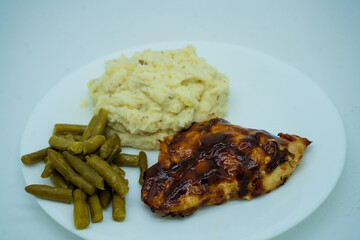 Barbecue Chicken, mashed potatoes and green beans.