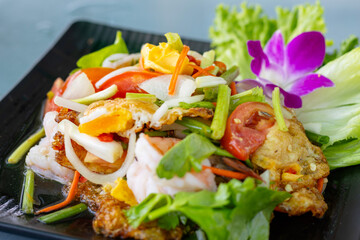 Fried egg salad with vegetables and fresh shrimp