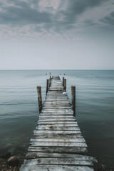Fototapeta premium Old abandoned pier at the sea, minimalist photography