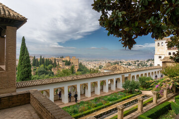 The Patio of the Irrigation Ditch (Patio de la Acequia) with the Alhambra Complex and Granada Town in the Background.