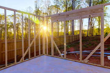 Wooden framing beams an unfinished house construction work in progress view
