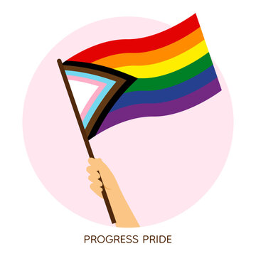 Hand holding rainbow progressive pride flag