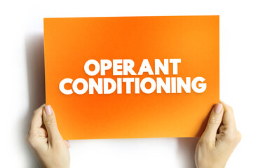 Operant Conditioning is a method of learning that uses rewards and punishment to modify behavior, text concept on card