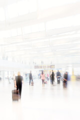 Fototapeta premium People, travel and airport in motion lens with luggage as transport to commute with speed or hurry for vacation. Global, crowd and walking in rush from lobby with suitcase for holiday as passenger