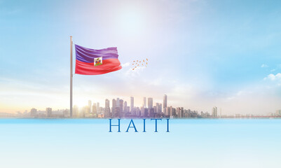 Haiti national flag waving in beautiful building skyline.