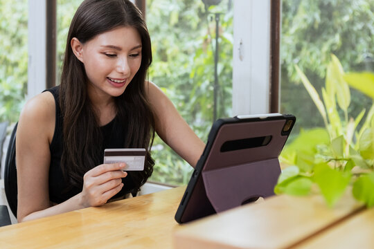 woman payment shopping online and checking money with credit card banking. Female joyful pay and sale service credit card. business finance e-commerce purchase information.