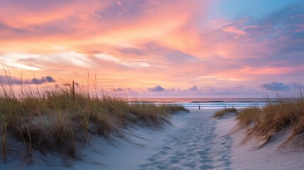 A beach at sunrise with pastel colored skies