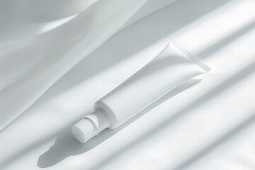 White tube on a white background, possibly for cosmetics or medical products, with a minimalist design.