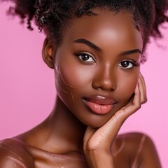 A beautiful young African-American woman proudly displaying stretch marks on her body against a pink background, captured in a closeup. - obrazy, fototapety, plakaty