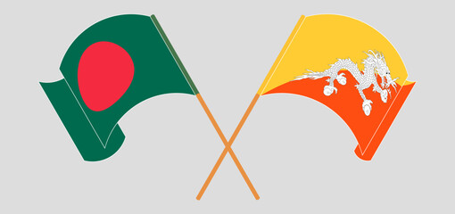 Crossed and waving flags of Bhutan and Bangladesh