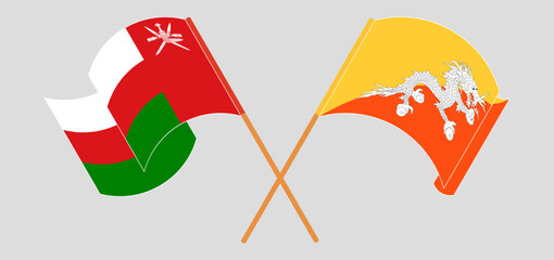 Crossed and waving flags of Oman and Bhutan
