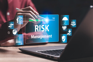 Risk management, business concept, Business Woman using laptop with a blue screen that says Risk Management. Concept of managing risks in a professional setting, business growth, Investment assessment