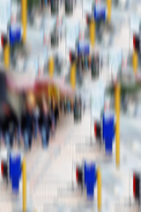 Motion blur, people and walking by traffic lights in street for commute, busy road or sidewalk in...
