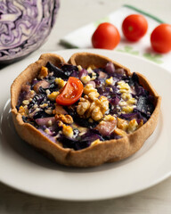 French quiche with red cabbage and vegetables. Traditional French recipe.