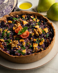 French quiche with red cabbage and vegetables. Traditional French recipe.