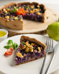 French quiche with red cabbage and vegetables. Traditional French recipe.