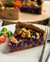 French quiche with red cabbage and vegetables. Traditional French recipe.
