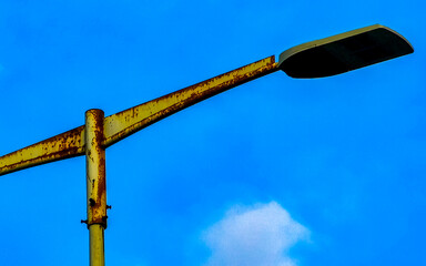 Streetlights LED light illumination with blue sky in Mexico.