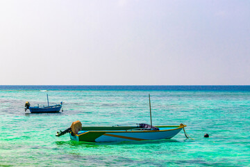 Motor engine of speedboat in the blue turquoise water Maldives.